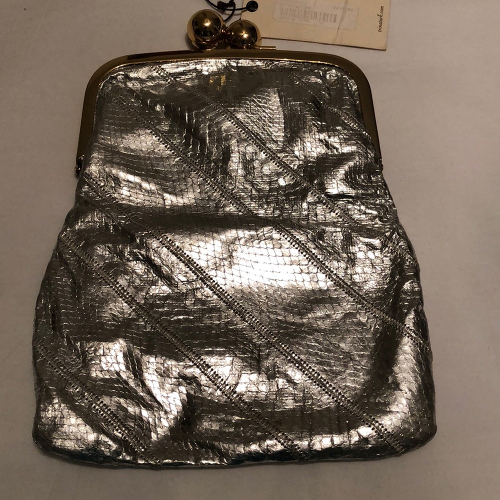 Metallic silver flap clutch by Trina Turk